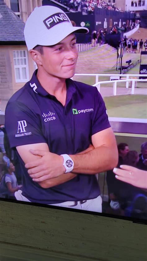 [identify] what is Viktor Hovland wearing right now at 